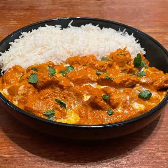 Delicious Butter Chicken Rice Bowl at Paratha 2 Pizza Calgary in Calgary, AB
